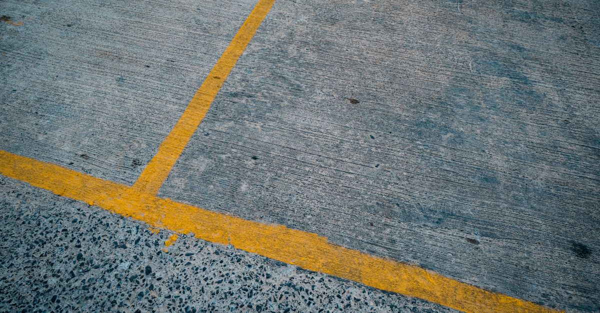 How Landscaping Choices Influence Driveway Stain Risks